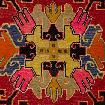 A RUG, an old Khotan probably, ca 151,5-153 x 83-85,5 cm.