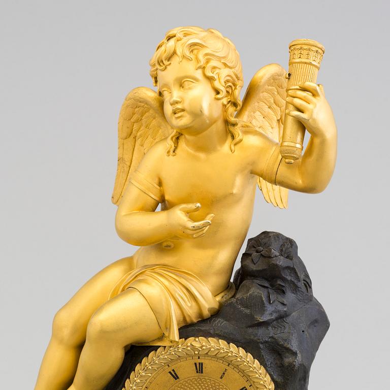 A French Empire bronze mantle clock.