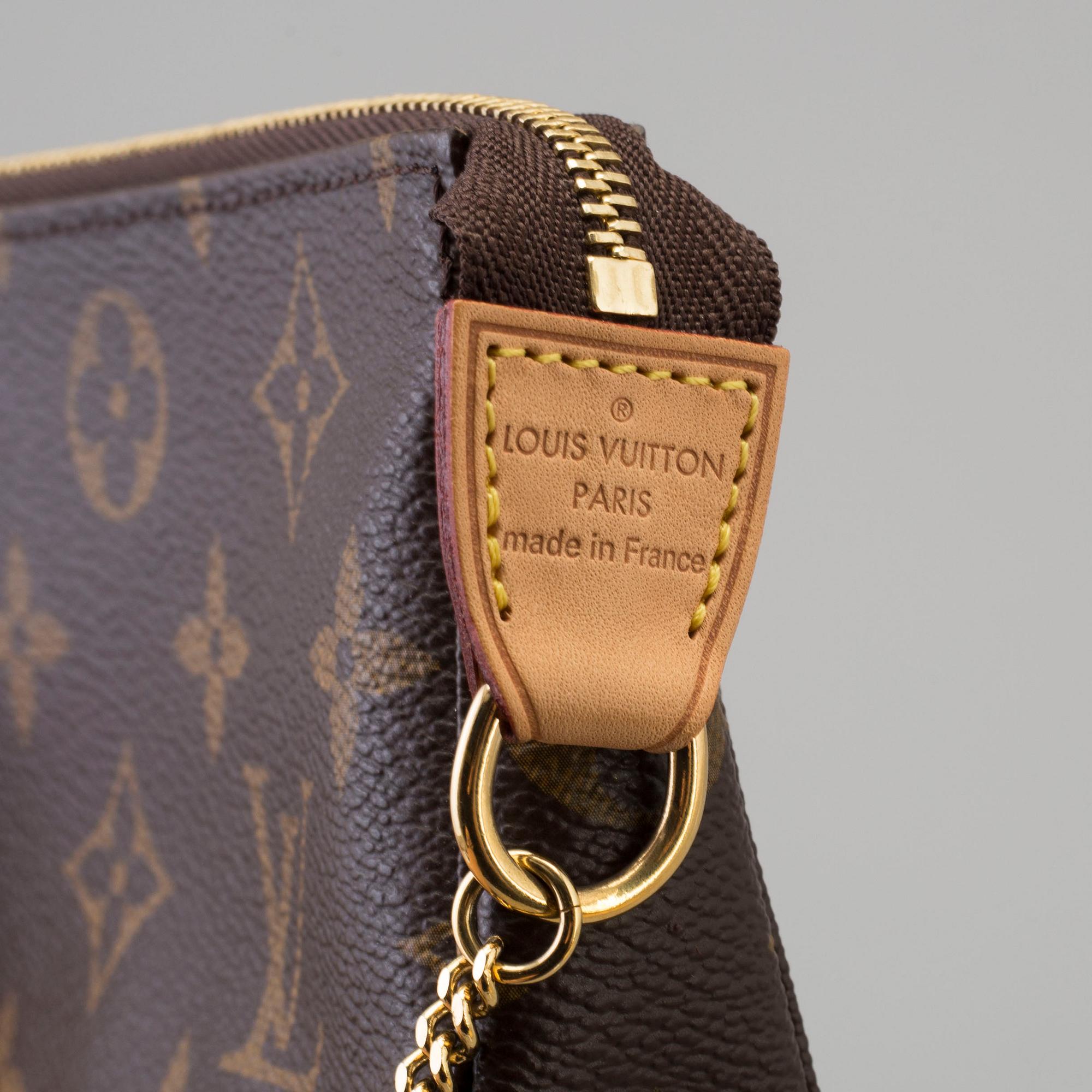a LOUIS VUITTON small bag pouch. Bukowskis