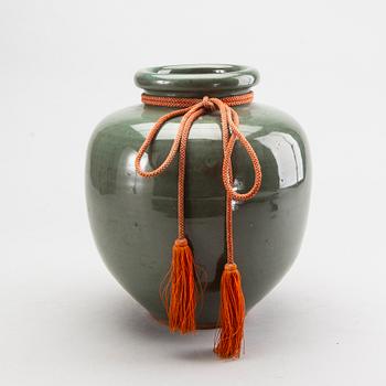 A Japanese eraly 20th century stoneware jar.