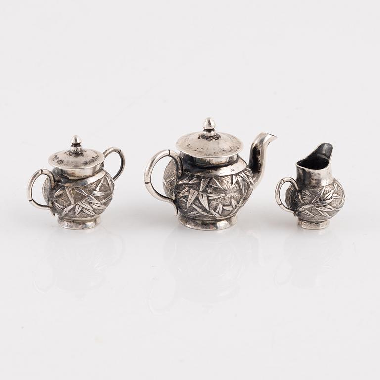 A Japanese Silver Minature Tea Service, probably early 20th Century, (3 pieces).