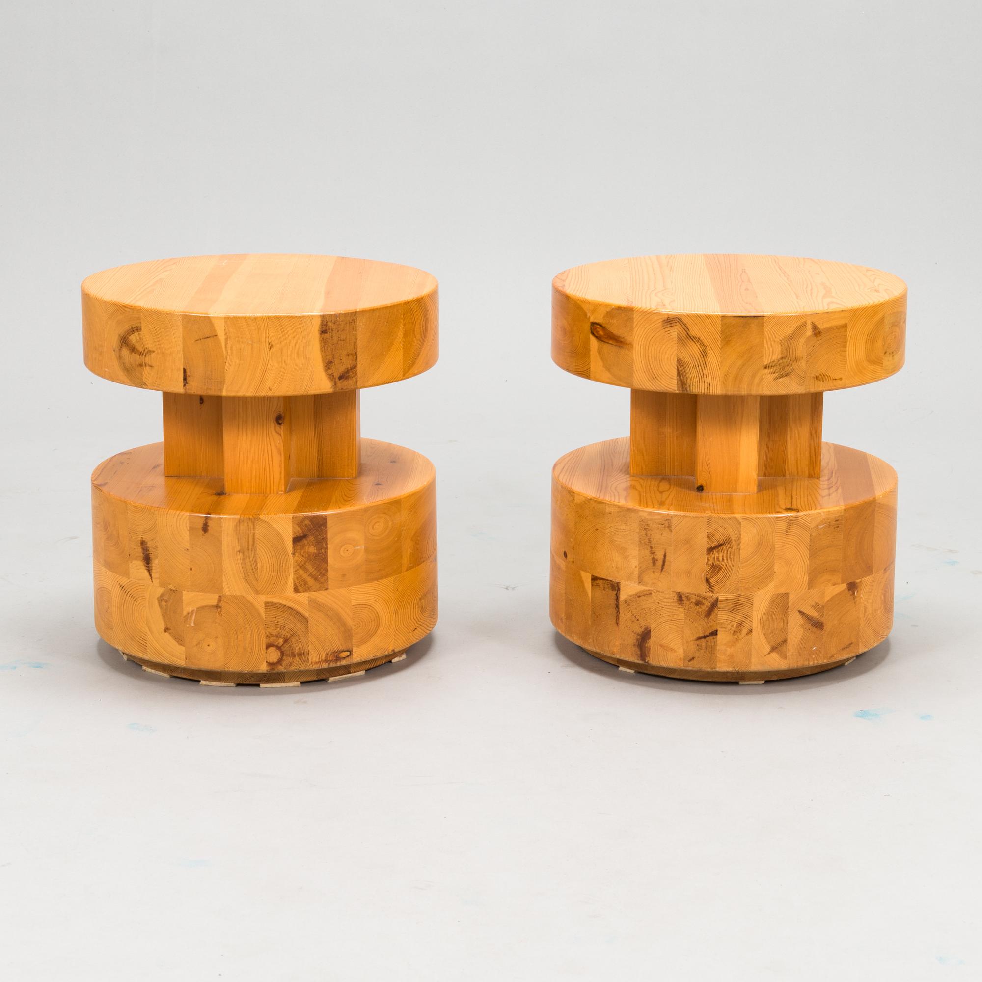 A pair of Finnish pinewood stools/ sidetables, late 20th century.