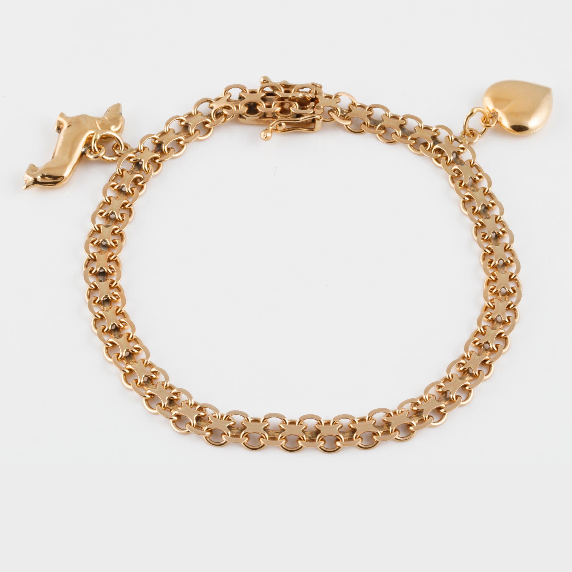 ARMBAND med 2 BERLOCKER, 18K guld, Bröderna Heden, Stockholm, 1969. Vikt 9,6 gram.