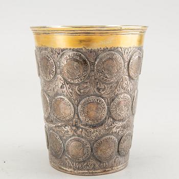 A German 18th century parcel-gilt silver coin-beaker, Frankfurt an der Oder, makers mark possibly ICST.