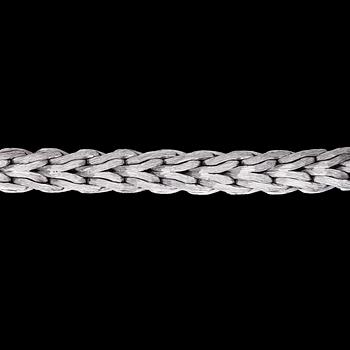 1059. A white gold bracelet, weight 169 g.