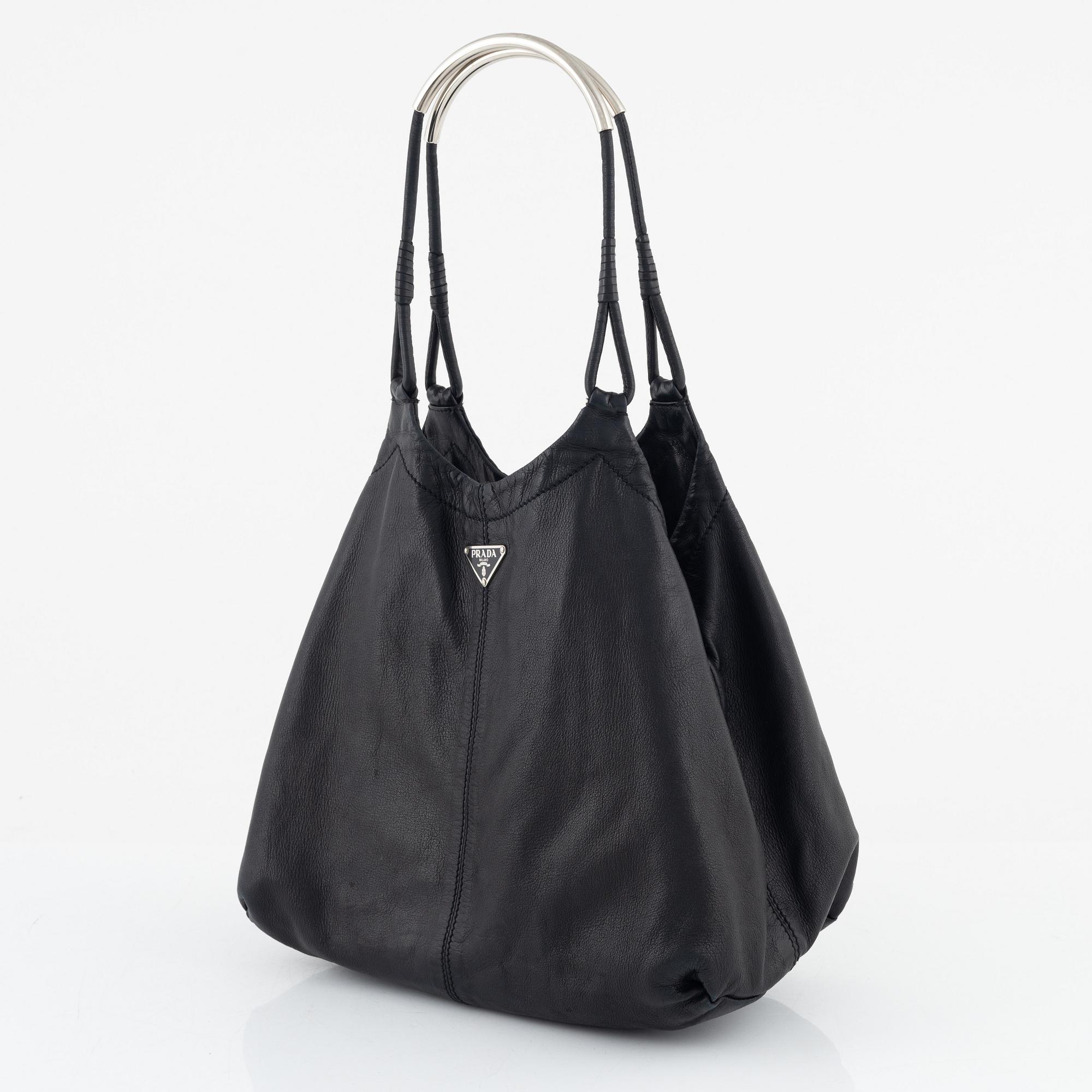 Prada, A black leather bag.