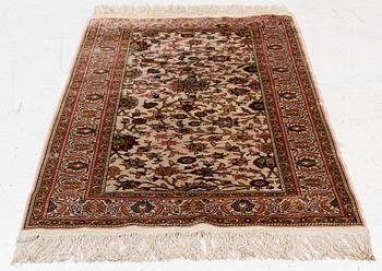 An Oriental silk rug, c. 122 x 76 cm.