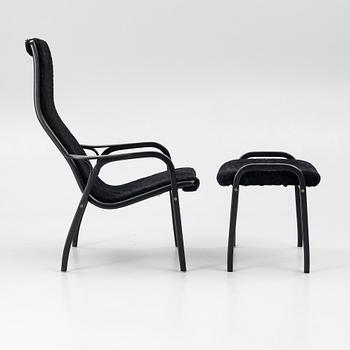 Yngve Ekström, a 'Lamino' easy chair with foot stool, Swedese 2010.
