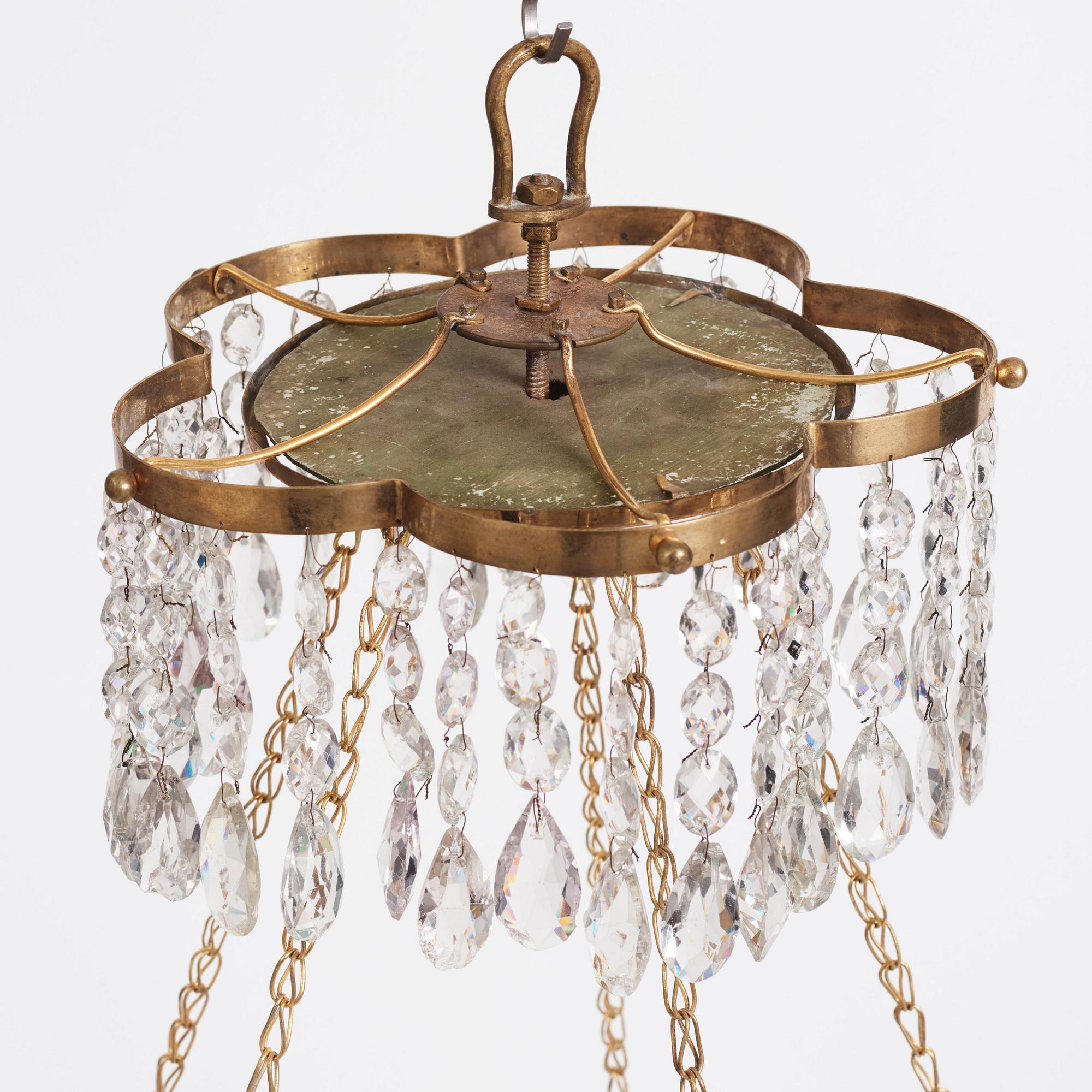 A late Gustavian gilt-brass and green glass six-light chandelier, late 18th century.