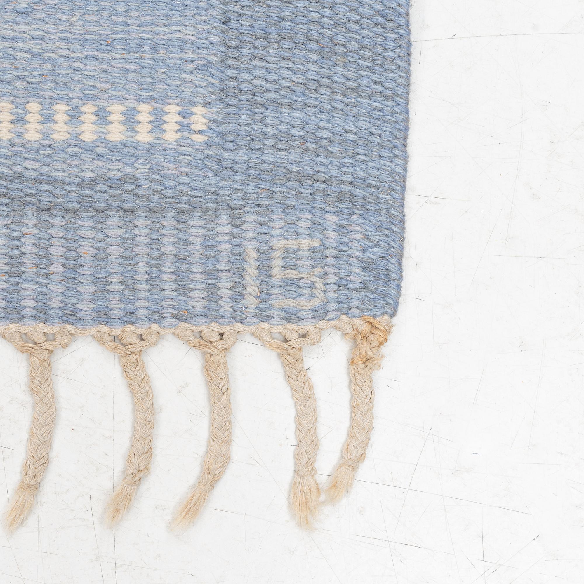 Ingegerd Silow, a carpet, c 235 x 166 cm, signed IS.