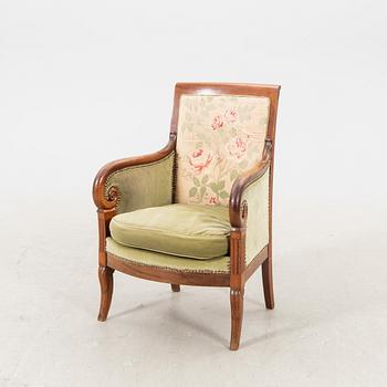 A mid 1800s mahogany bergere.