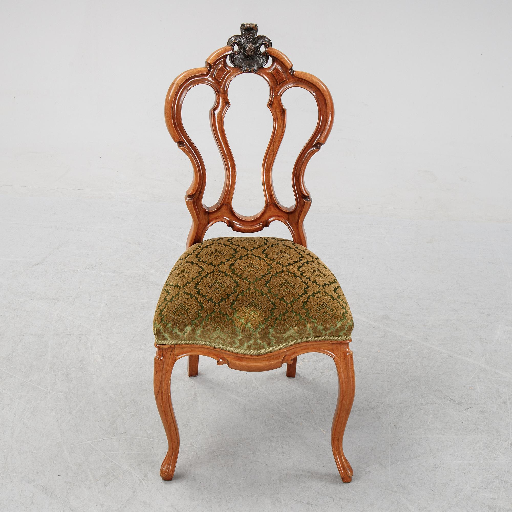 A rococo style sofa, four chairs and a table, second half of the 19th Century.