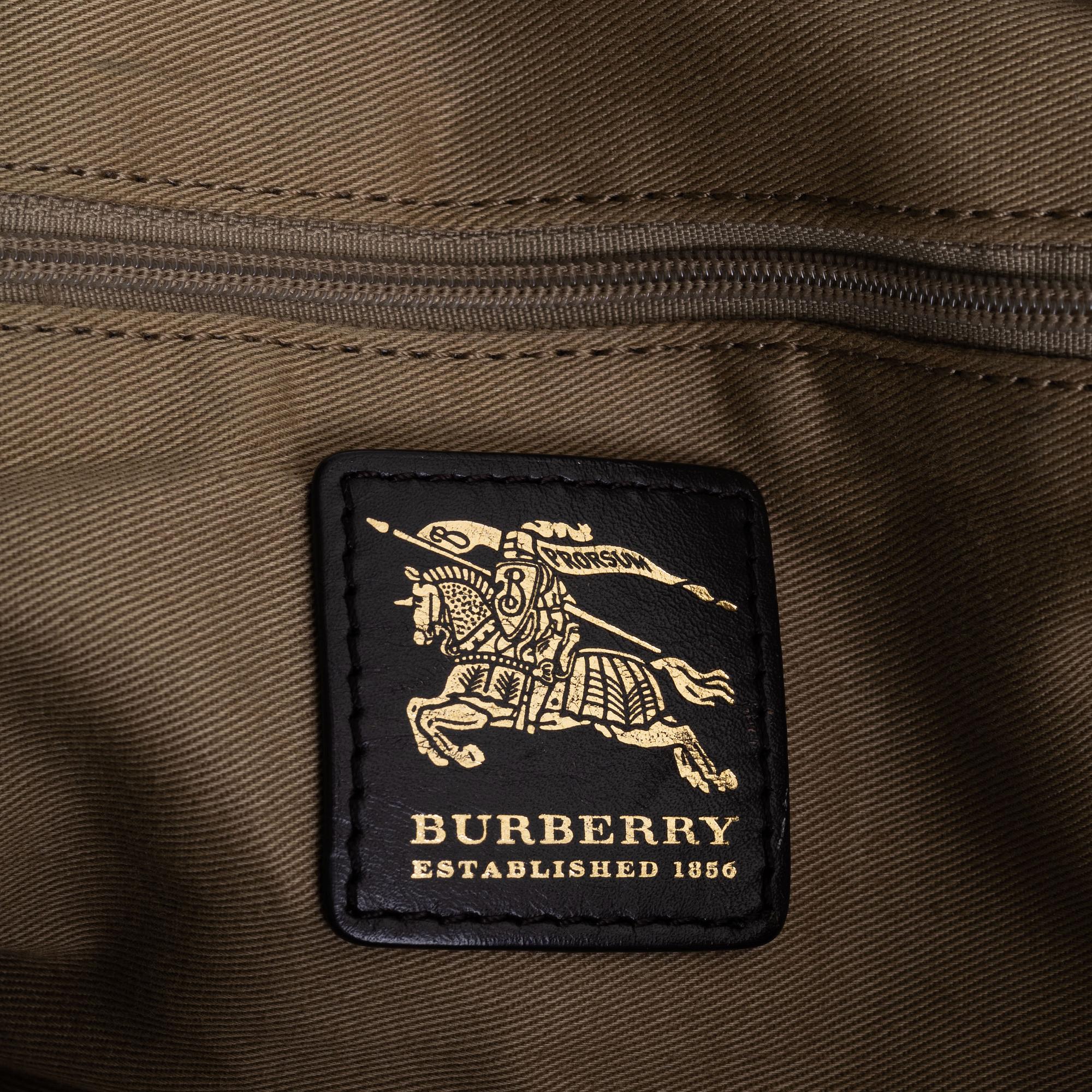 Burberry, a canvas weekend bag.