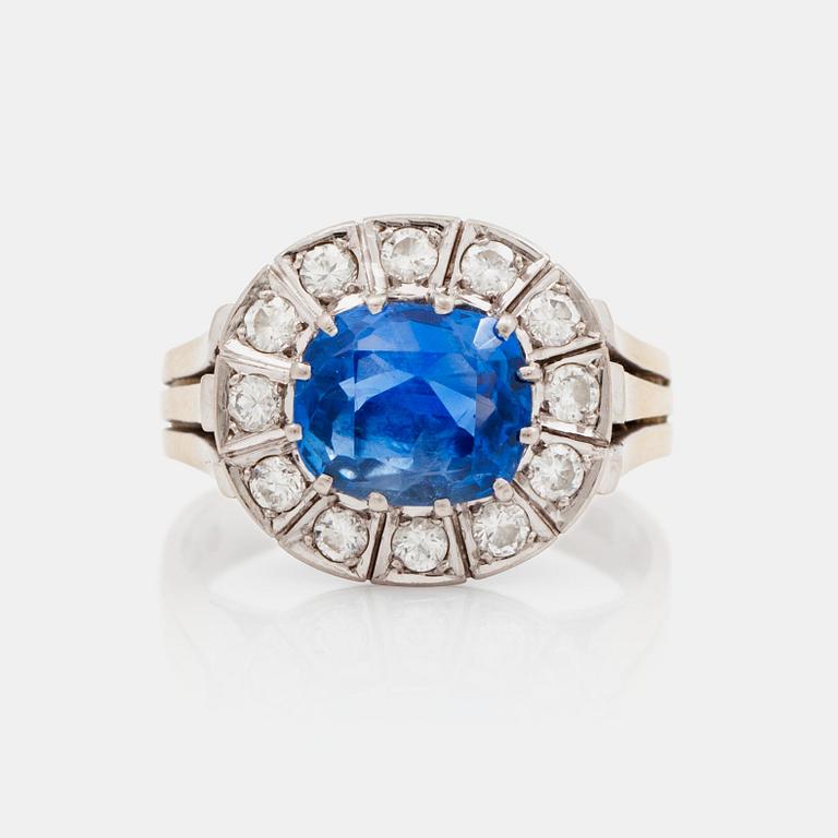 A 3.39 ct untreated sapphire and brilliant cut diamond ring. Total carat weight of diamonds 0.55 ct.