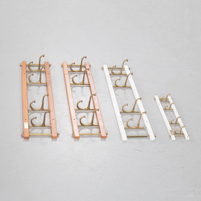 Four circa mid 20th century clothes hangers, "Dekorativ" by Skoglunds metallgjuteri.