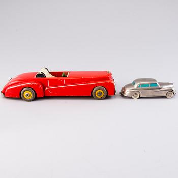 Two mid-20th century toy cars, chromed metal and wood.