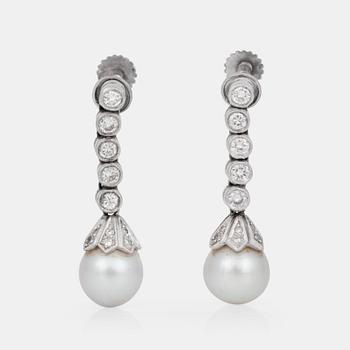 823. A pair of probably cultured pearl and diamond earrings. Total carat weight of diamonds circa 0.30 ct.