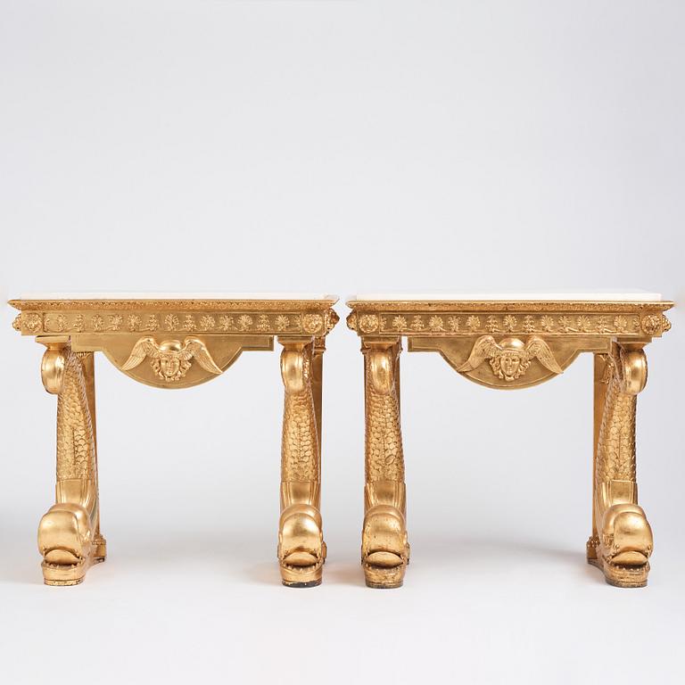 A pair of Swedish Empire carved and giltwood console tables, first half of the 19th century.