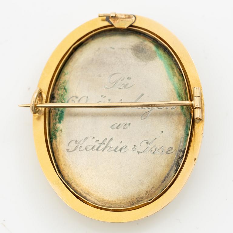 Brooch in silver and gold with rose-cut diamonds in the form of a plume, circa 1900.