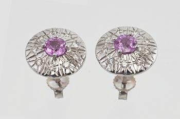 A PAIR OF DIAMOND EARRINGS.