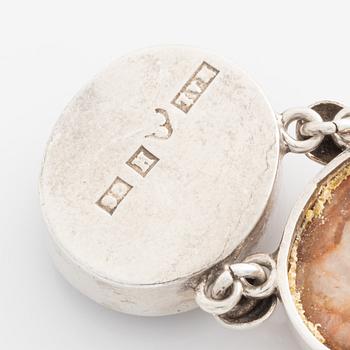 Bracelet silver with cabochon-cut stones.