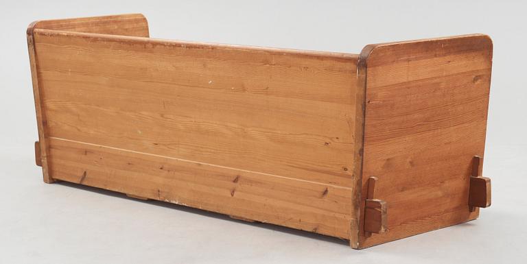 An Axel Einar Hjorth 'Lovö' stained pine sofa, Nordiska Kompaniet, Sweden 1930's.