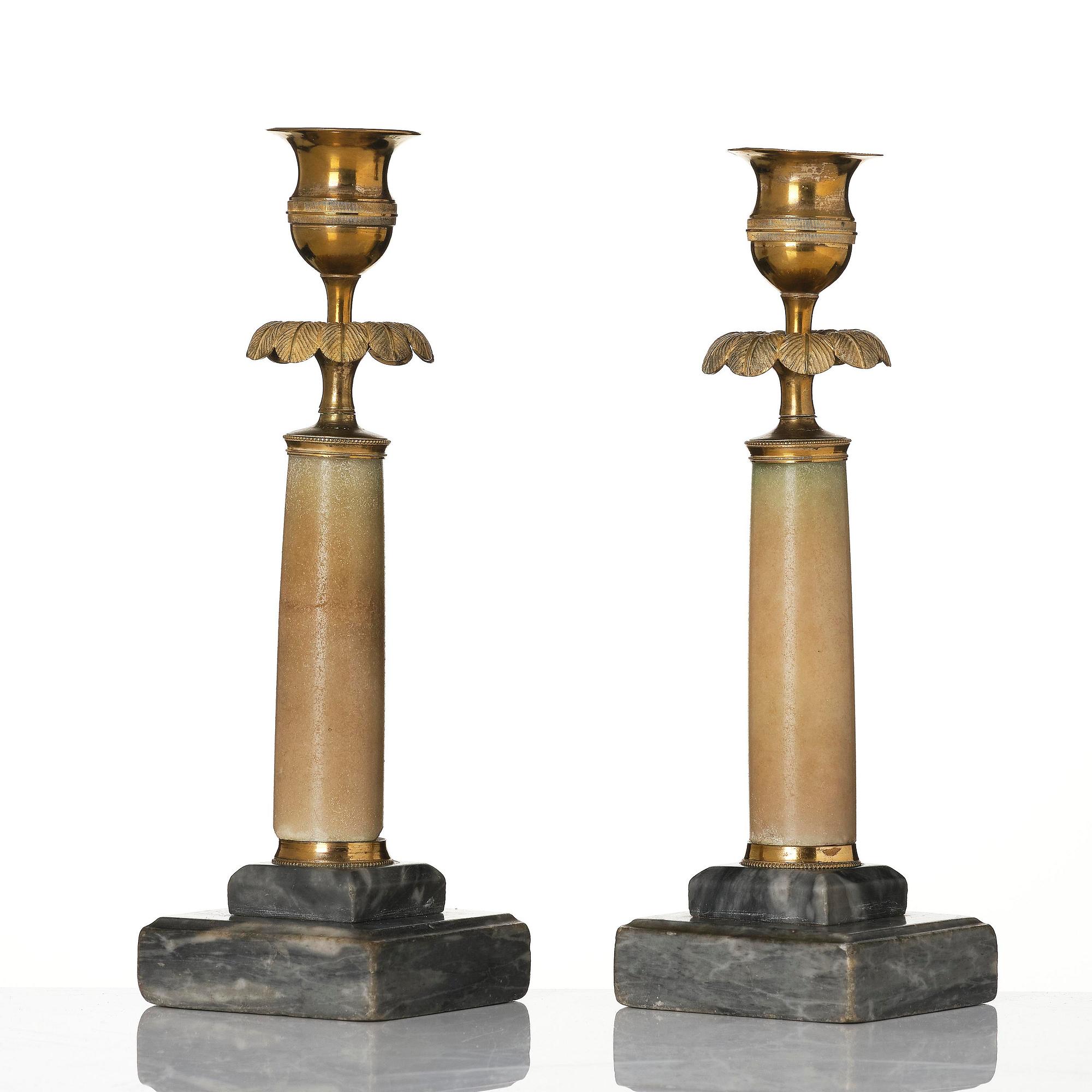 A pair of late Gustavian gilt brass and marble candlesticks, Stockholm, late 18th century.