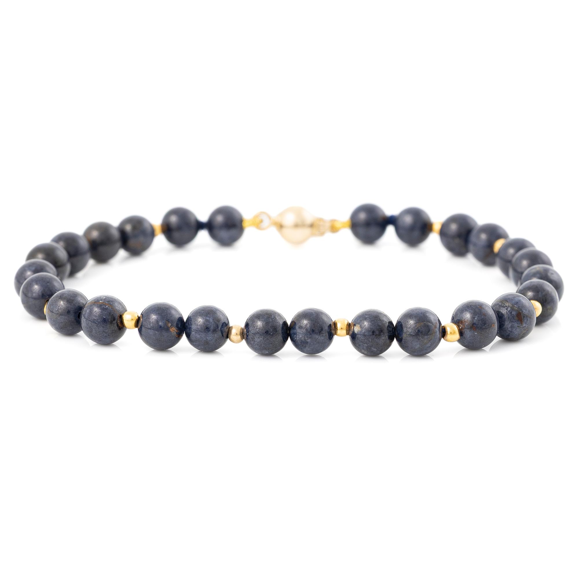 Bracelet with blue stones and 18K gold clasp.