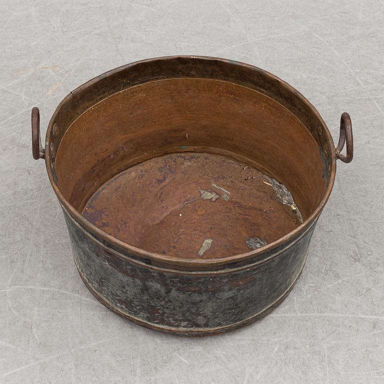 A 19th century copper cauldron.