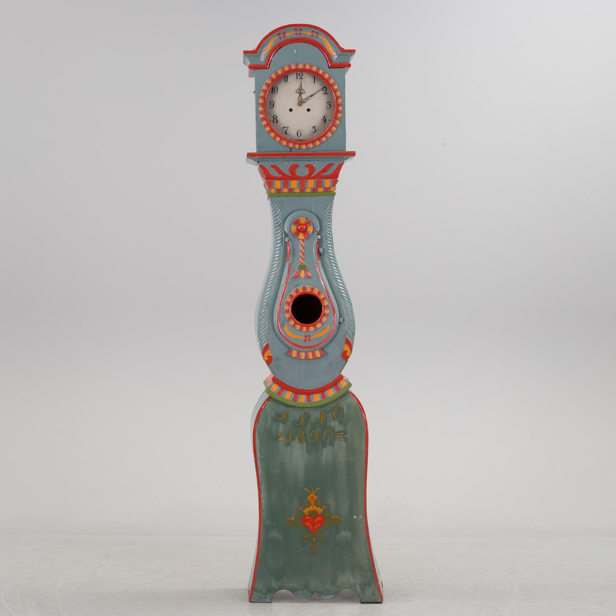 a painted grandfather-clock from the first half of the 19th century.