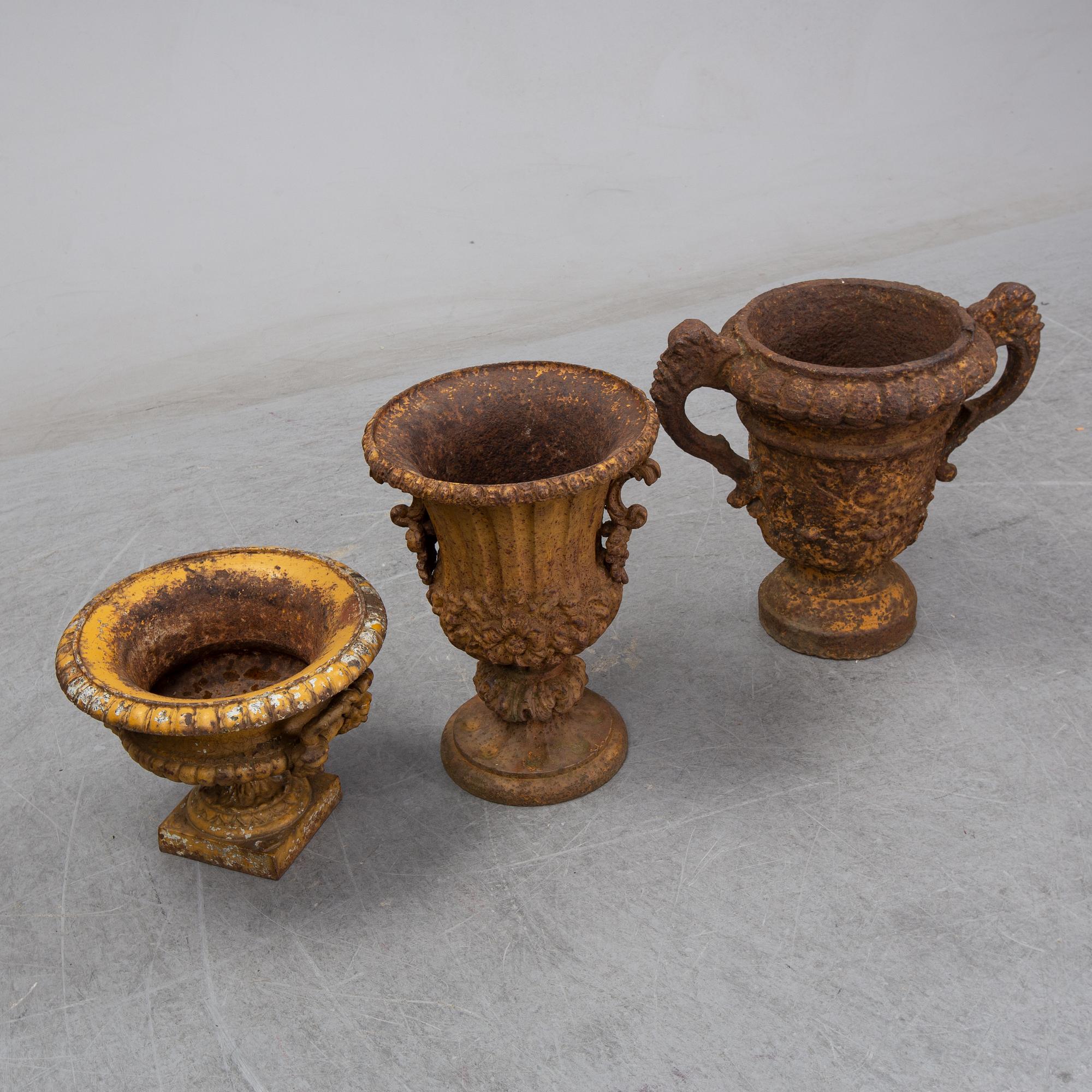 Two 19th century cast iron urns.
