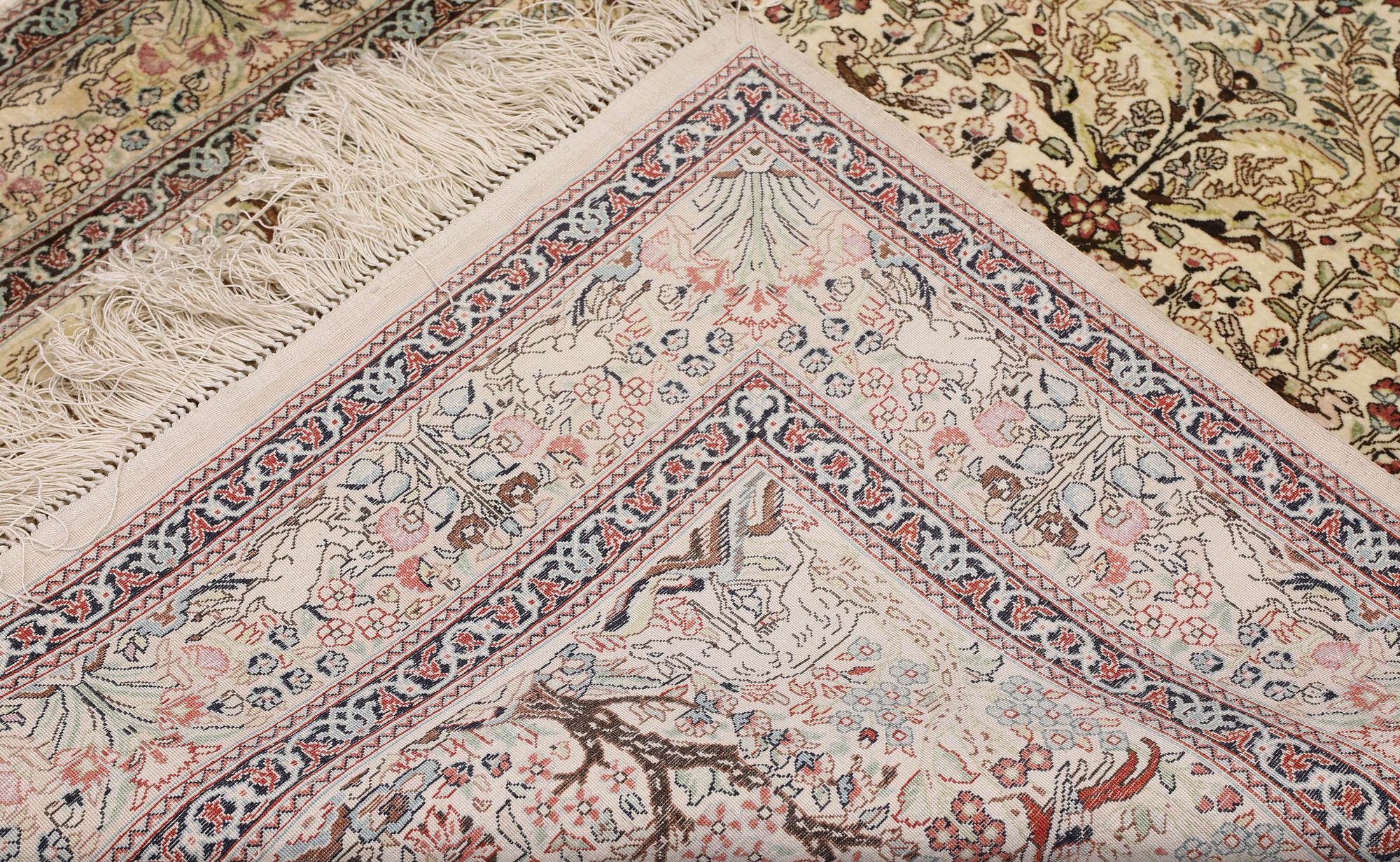 A Oriental silk carpet, 152 x 94 cm.