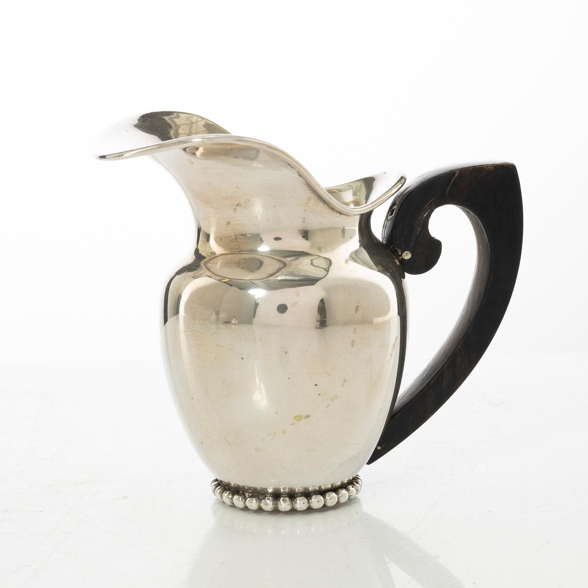 An Italian silver teapot, cream jug and sugar bowl, 20th century.