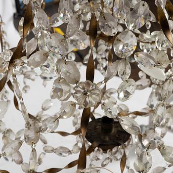 A late Gustavian gilt brass and cut glass seven-light chandelier, Stockholm, late 18th century.