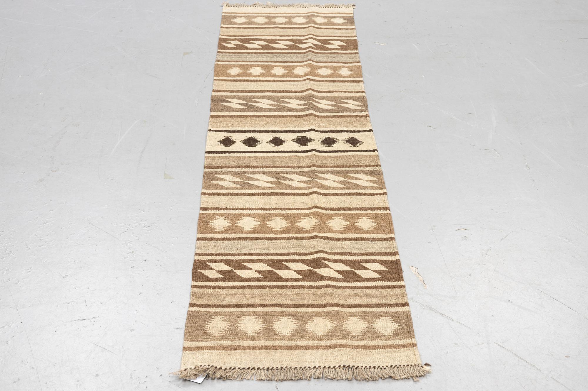 A runner, kilim, ca 240 x 62 cm.