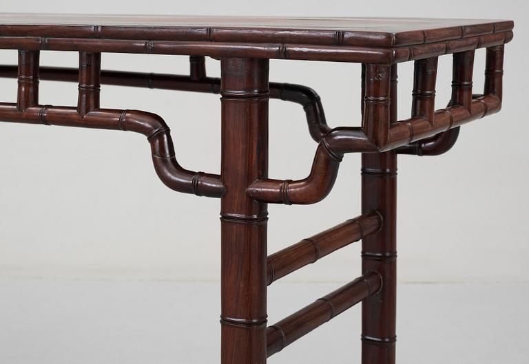 A hardwood free standing table, Qing dynasty.