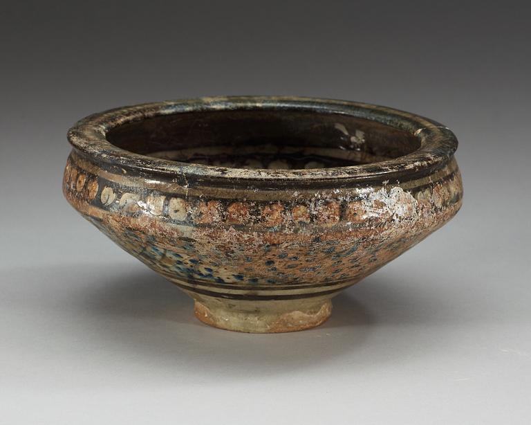 BOWL, pottery. Decoration in black, white and blue. Persia 14th century, probably Sultanabad.