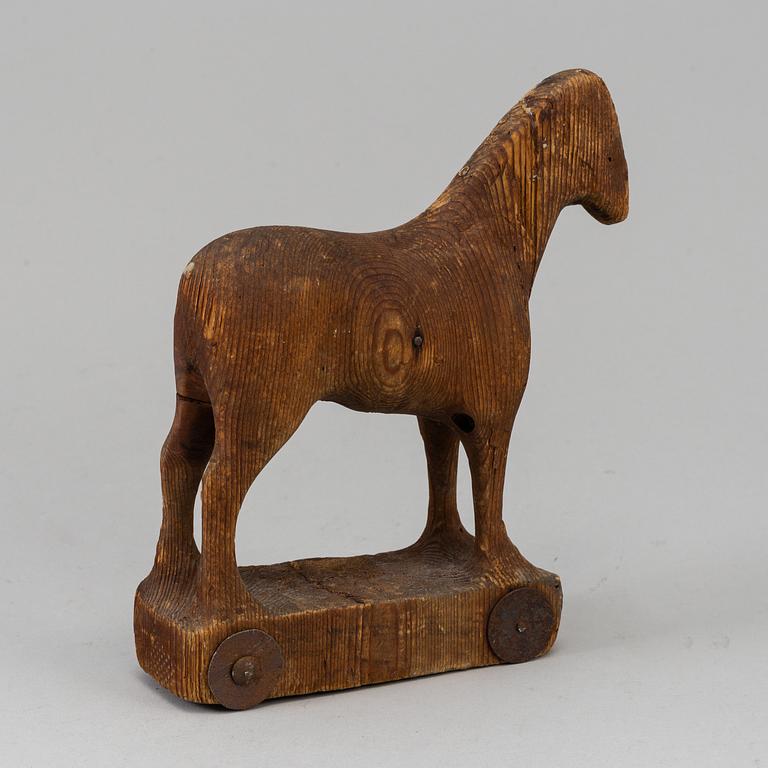 A wooden toy horse, marked Berglinds Leksaksfabr, Nyköping, early 20th century.