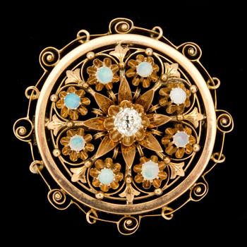 A 0.20 ct old-cut diamond and opal brooch.