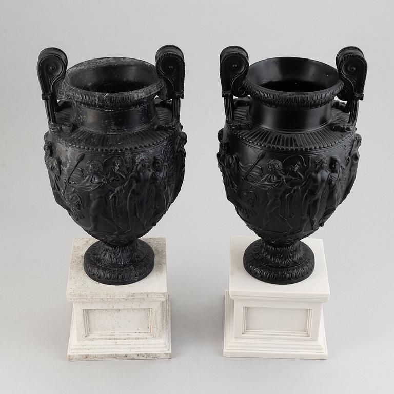 A pair of basalt ware volute vases, 19th century.