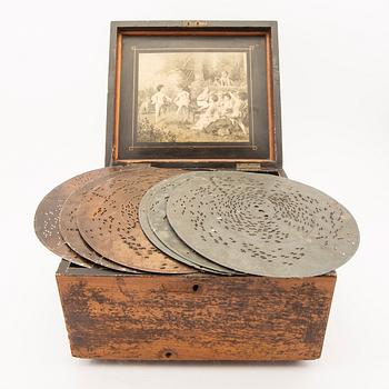 Polyphon wooden music box with sevem discs, around 1900's.