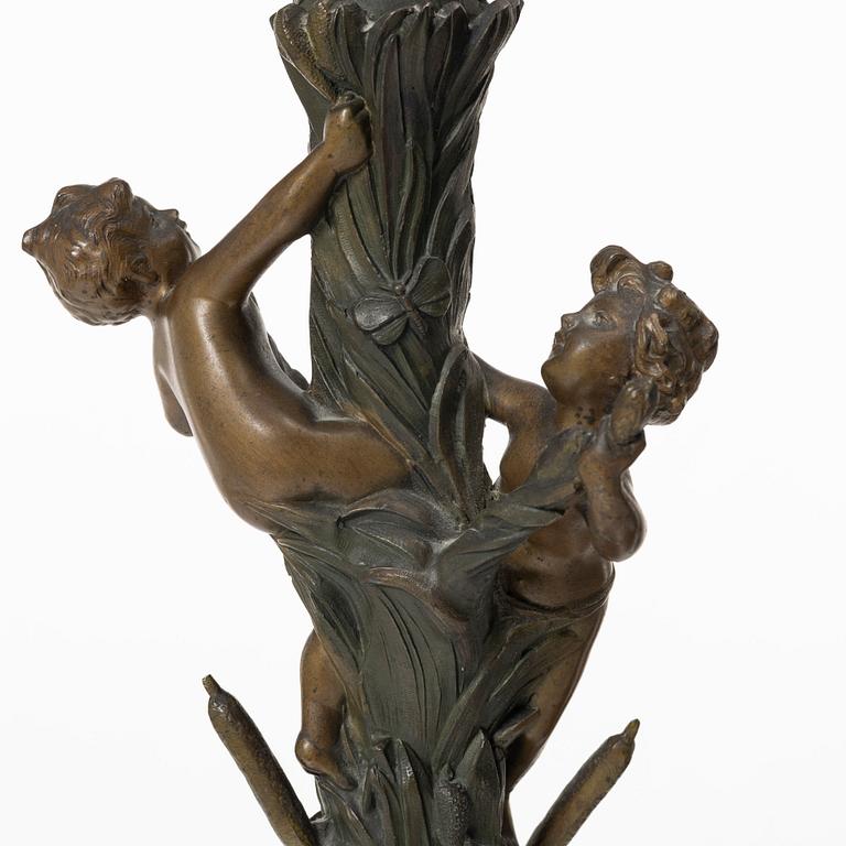 a pair of bronze and marble candle sticks, after a model by Houdon, late 19th century.