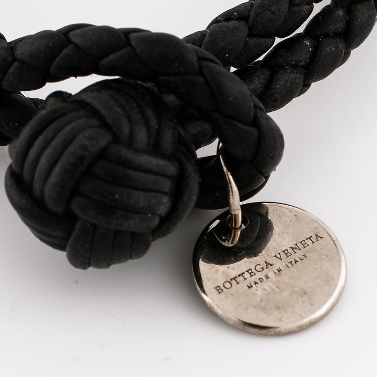 A bracelet by Bottega Veneta.