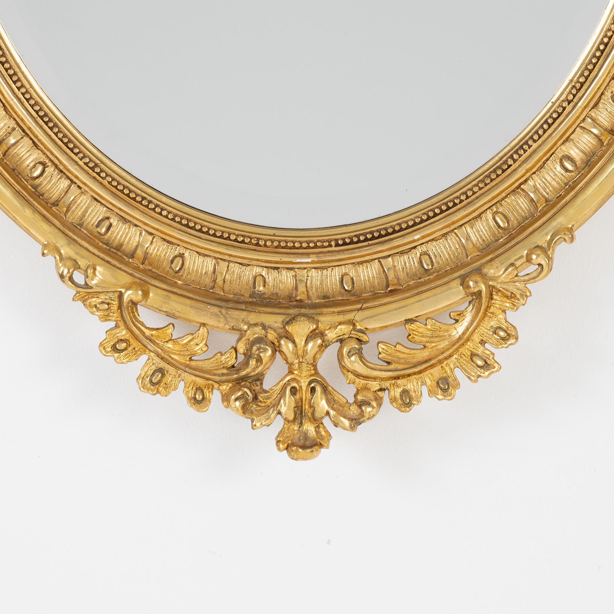 A Rococo style mirror, first half of the 20th Century.