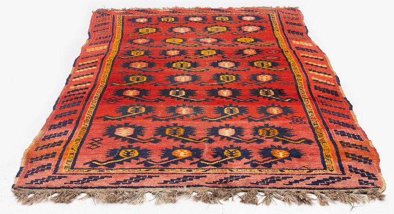 An antique Central Asian carpet, possibly Kirghiz, c. 346 x 154 cm.