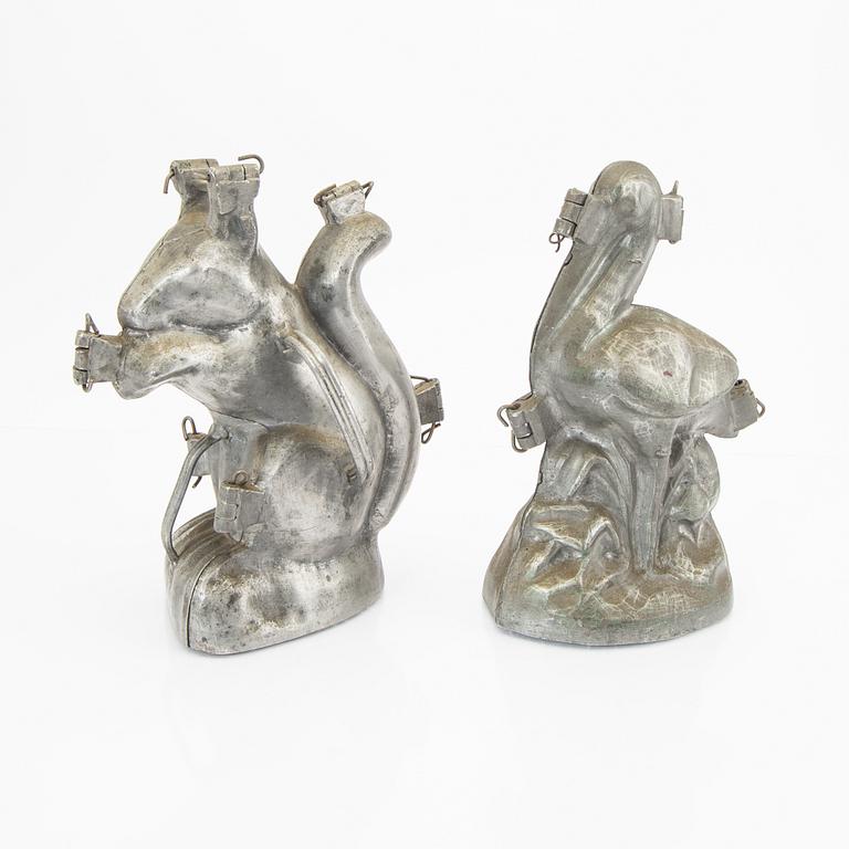 A set of four pewter icecream moulds around 1900.