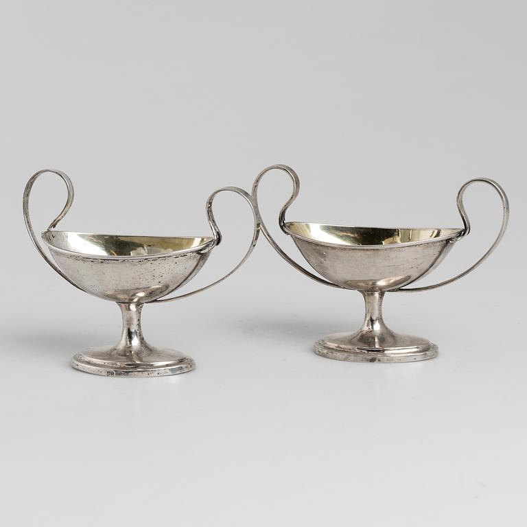A pair of firt half of the 19th century parcel-gilt silver salt-cellars by an uknown master, one marked HB.