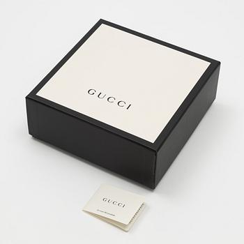 Gucci, a wool and silk mix "GG" jaquard shawl.