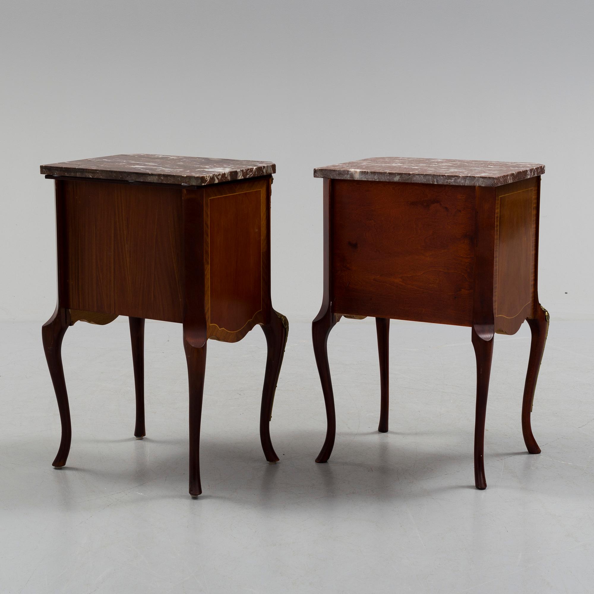 A pair of mid 20 th century mahogany bedside tables.
