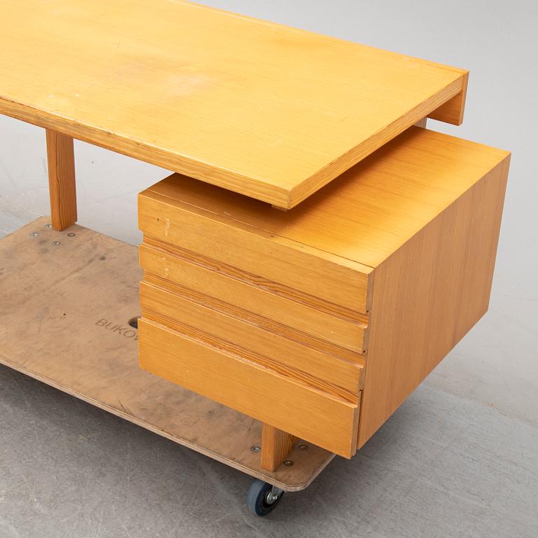 A pine writing desk by Olavi Hänninen for Nupponen, second half of the 20th Century.